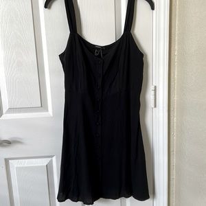 Forever 21, black dress never worn with tags and extra button, size medium